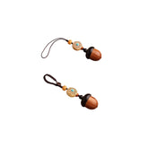Pair of pine-cone style wooden urn keychains, acorn silhouette with turquoise-pattern bead and loop strap — mini ashes keepsake