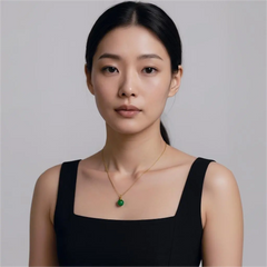 Model wearing green agate urn necklace, simple gold chain resting close to heart, elegant cremation jewellery style.