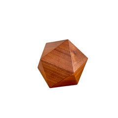 Lyra Pet Urn, studio product shot — sapele icosahedron on white.