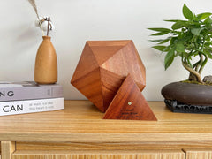 Lyra Pet Urn, sapele icosahedron with removable triangular access panel (open view).