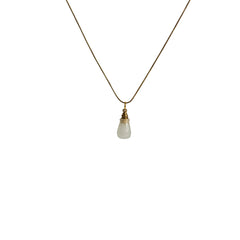 Natural agate ashes necklace hanging on gold chain, product close-up