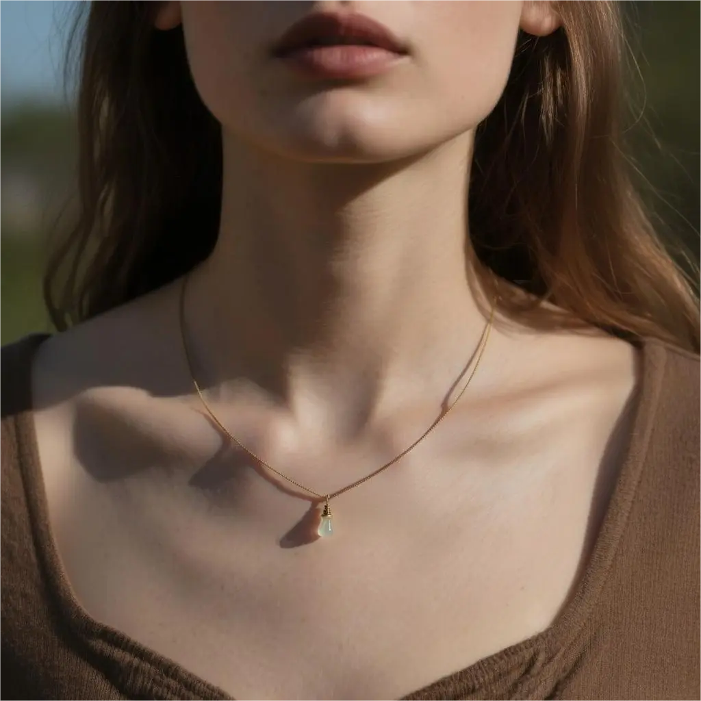 Model wearing natural agate cremation necklace outdoors, subtle memorial jewellery