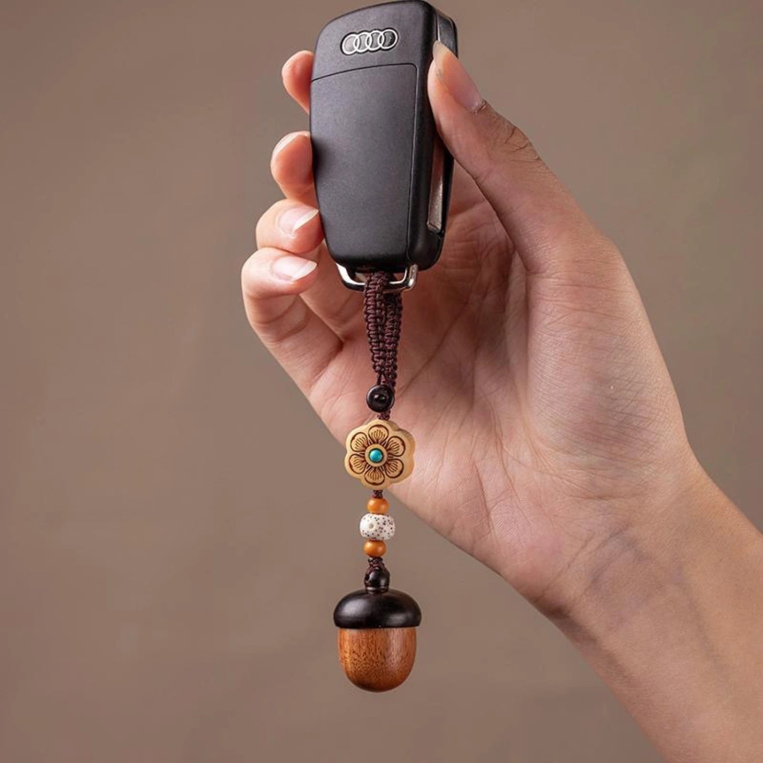 Pine Cone Urn Keychain — hanging from car key fob