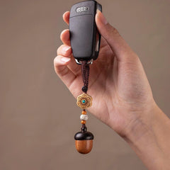 Pine Cone Urn Keychain — hanging from car key fob