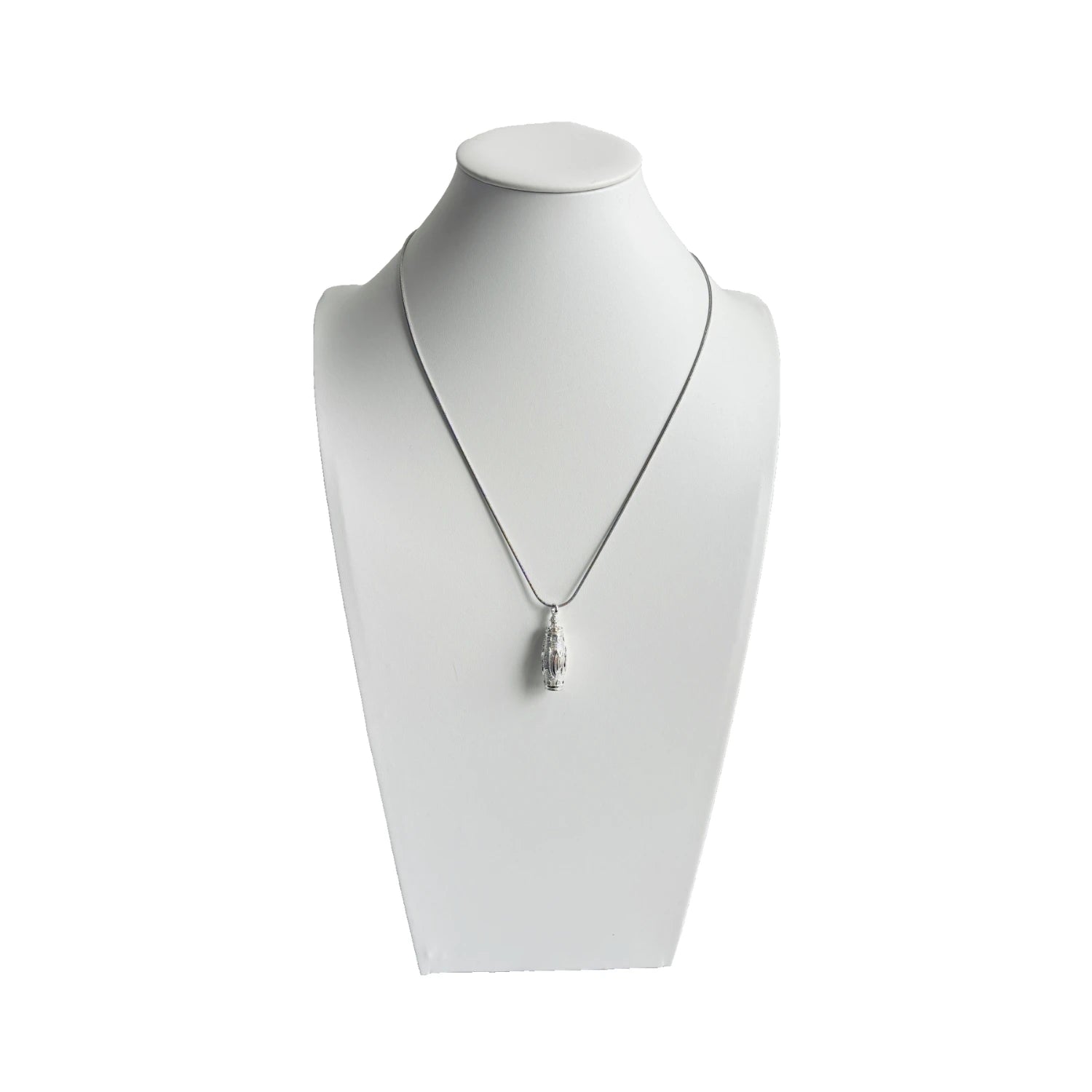 Snow Ridge micro-engraved ashes necklace on display bust — sterling-silver cremation jewellery pendant with snake chain.