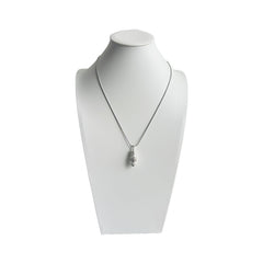 Snow Ridge micro-engraved ashes necklace on display bust — sterling-silver cremation jewellery pendant with snake chain.