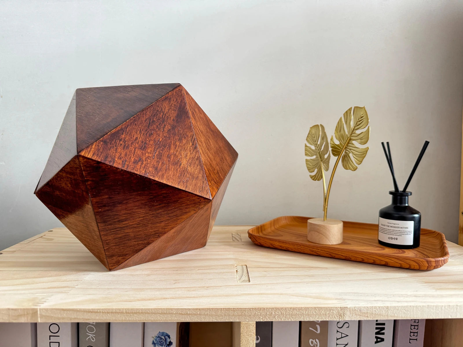 Solace Pet Urn — handmade walnut pet urn for ashes on a wooden desk with bookshelf background