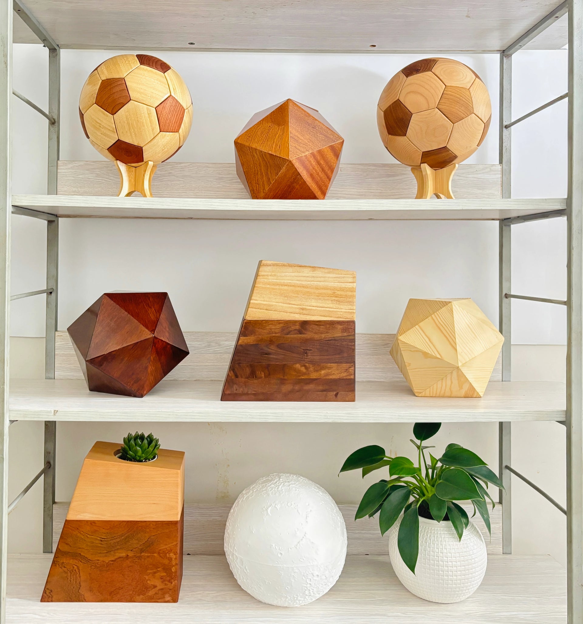 about us – Hushsoul wooden pet urns displayed on shelf: football, icosahedron, and vase urn styles